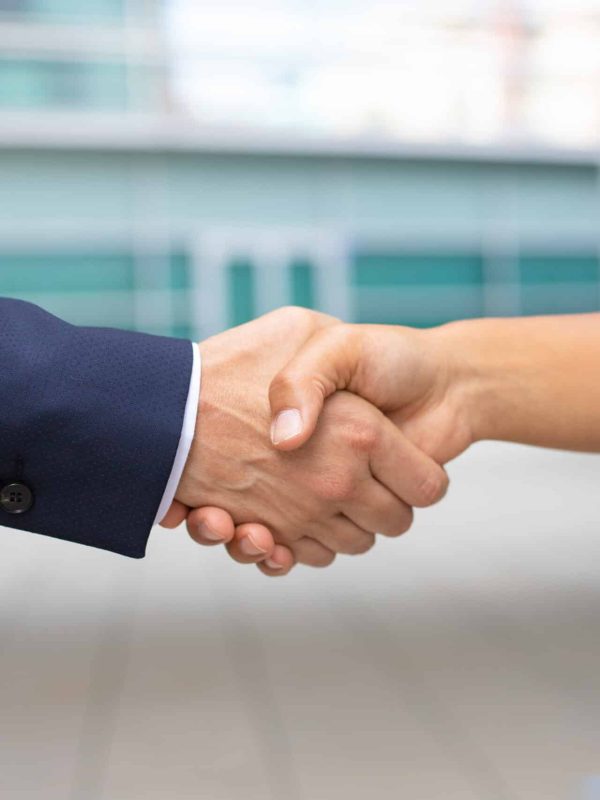 Closeup shot of business handshake. Cropped shot of two people wearing formal suits shaking hands. Business handshake concept