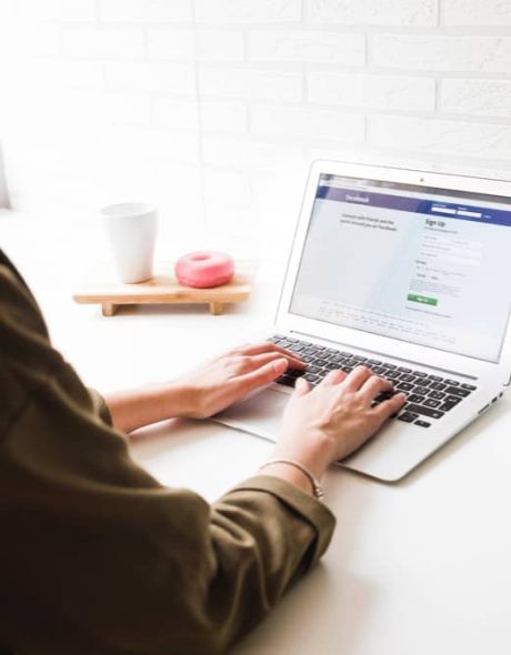 woman-login-into-facebook-website-laptop